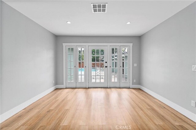 doorway to outside with french doors and light hardwood / wood-style floors