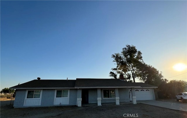 single story home featuring a garage