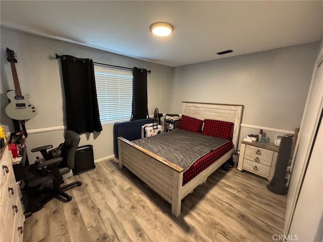 bedroom featuring light hardwood / wood-style flooring