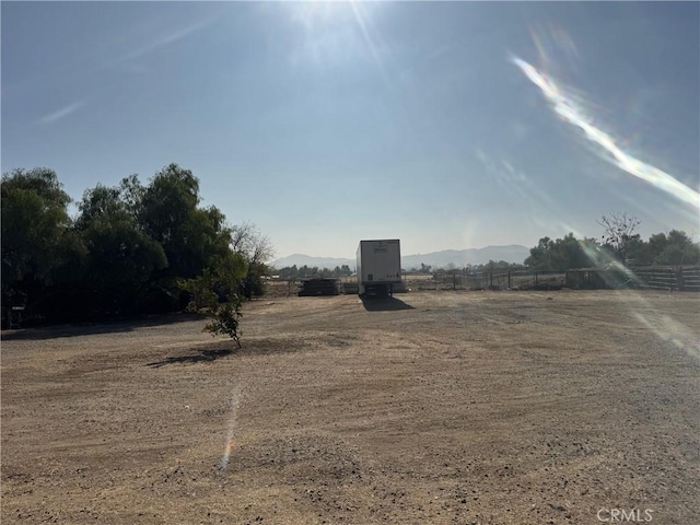 view of yard featuring a mountain view and a rural view