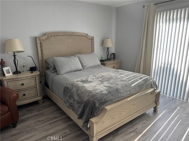 bedroom featuring dark hardwood / wood-style flooring