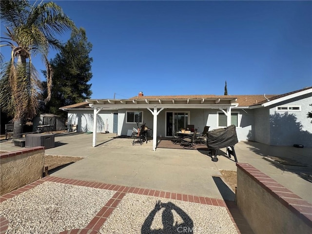 back of house with a patio area