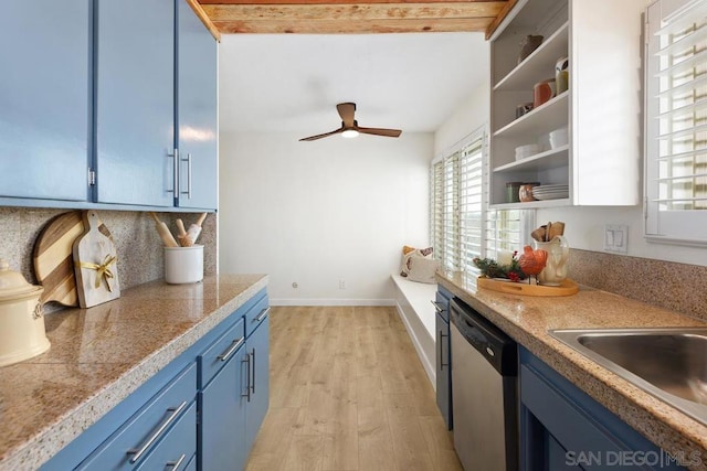 kitchen featuring light wood-type flooring, tasteful backsplash, stainless steel dishwasher, blue cabinetry, and beamed ceiling