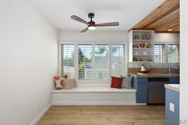 unfurnished room with ceiling fan, light hardwood / wood-style flooring, and sink