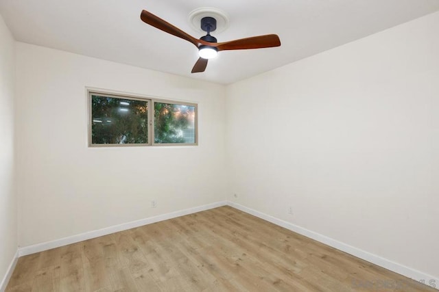 empty room with light hardwood / wood-style flooring and ceiling fan