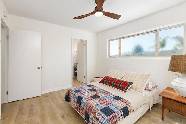 bedroom with light hardwood / wood-style flooring and ceiling fan