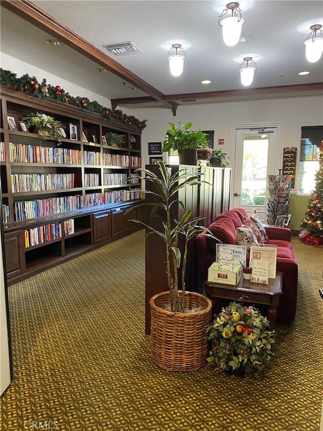 living area featuring ornamental molding, carpet flooring, and visible vents