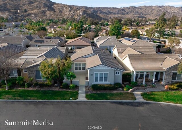 drone / aerial view featuring a mountain view