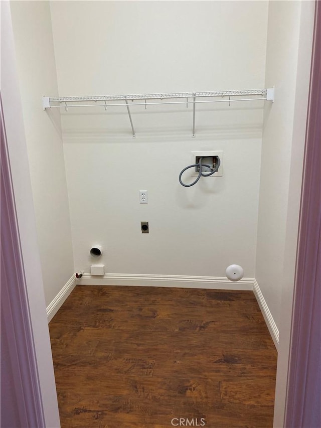 laundry area with laundry area, hookup for an electric dryer, gas dryer hookup, and baseboards