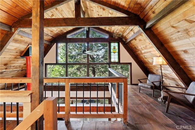 additional living space featuring ceiling fan, lofted ceiling with beams, hardwood / wood-style floors, wooden walls, and wood ceiling