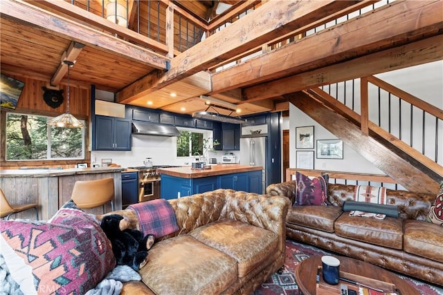 living room featuring beam ceiling and wooden ceiling