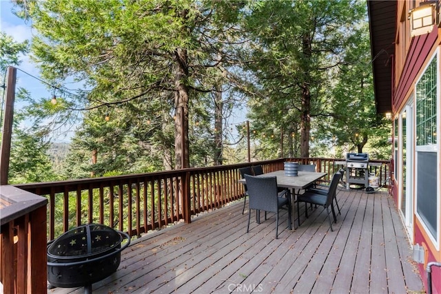 wooden terrace featuring area for grilling