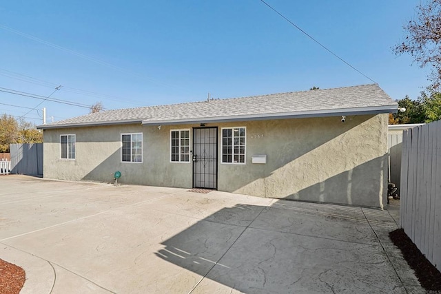 back of property with a patio area