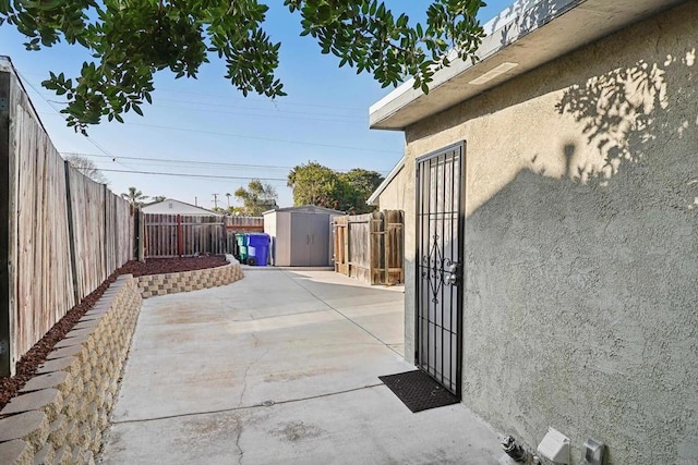 view of patio / terrace with a storage unit