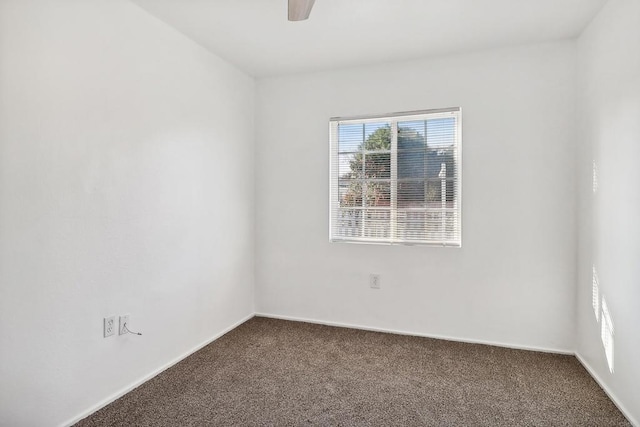 carpeted empty room with ceiling fan