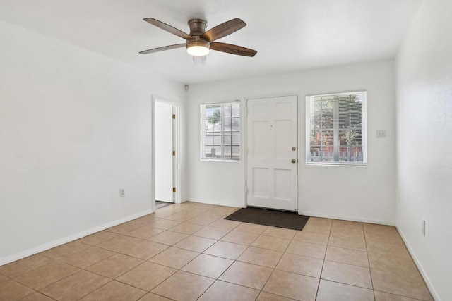 entryway featuring ceiling fan and light tile patterned flooring