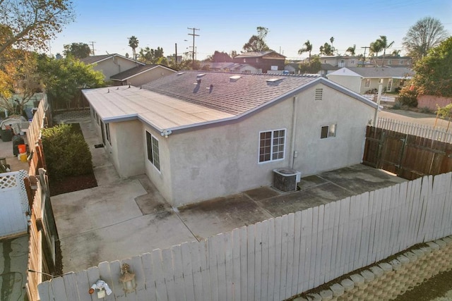 back of house with a patio