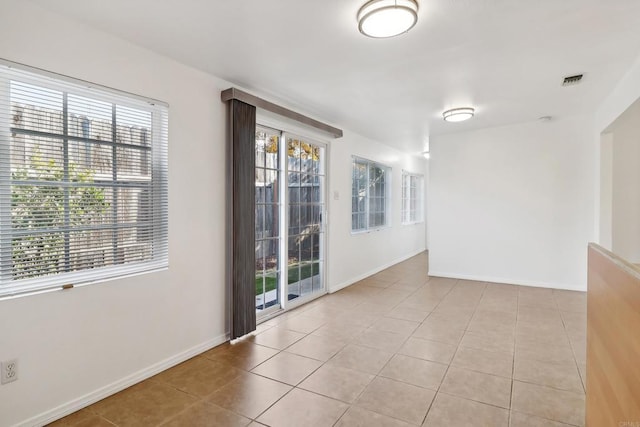 view of tiled spare room