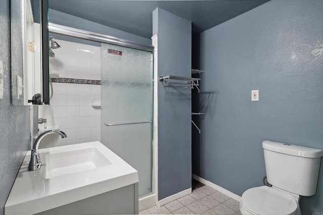 bathroom featuring walk in shower, sink, tile patterned flooring, and toilet