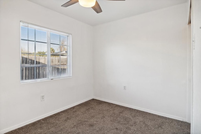 empty room with ceiling fan and carpet