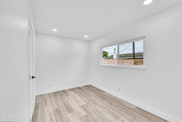 unfurnished room featuring light wood-type flooring