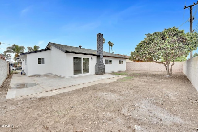 back of house featuring a patio area