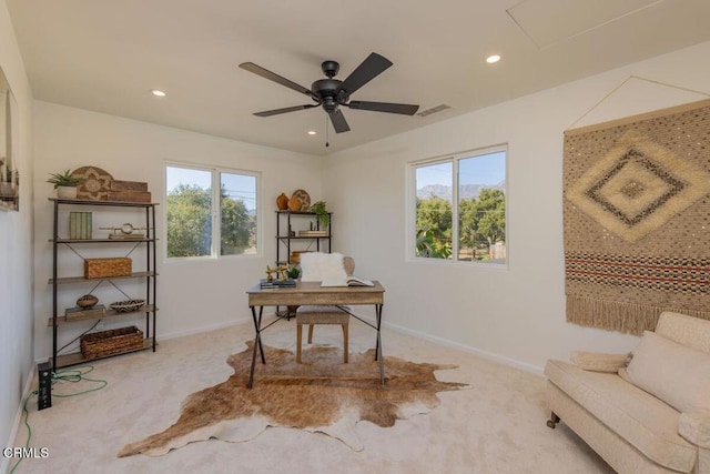 office space featuring ceiling fan and light colored carpet