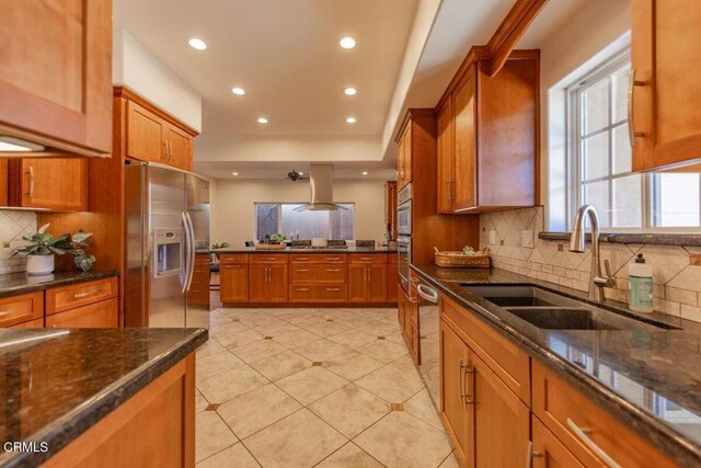 kitchen featuring backsplash, sink, light tile patterned flooring, and stainless steel appliances