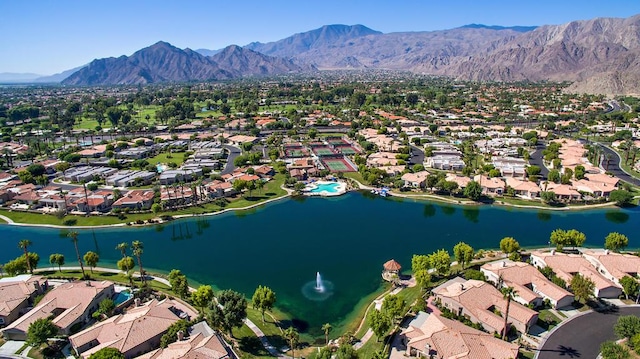 bird's eye view with a water and mountain view