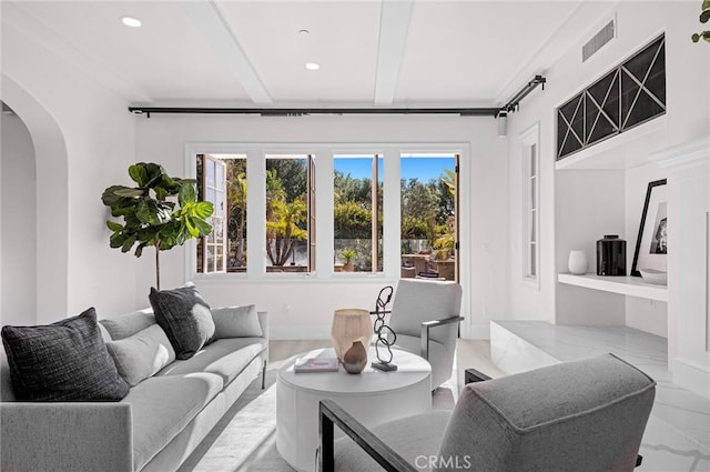 living room with beam ceiling