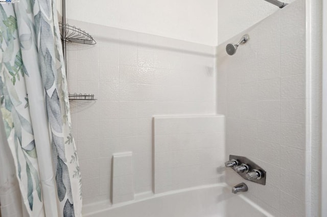 bathroom featuring shower / tub combo with curtain