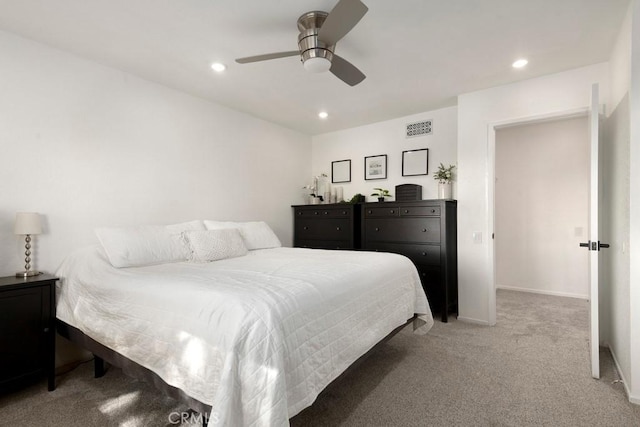 carpeted bedroom with ceiling fan