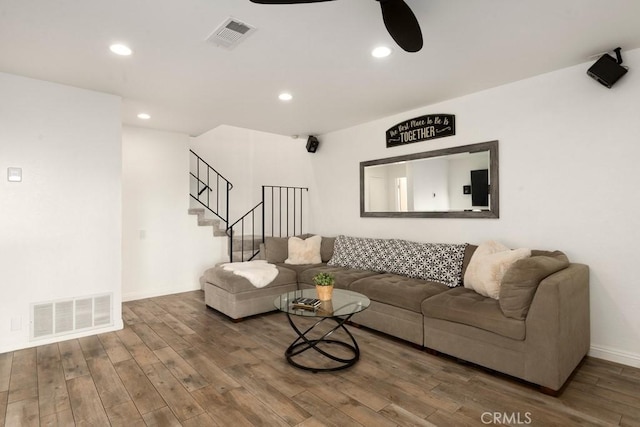 living room featuring ceiling fan and wood-type flooring