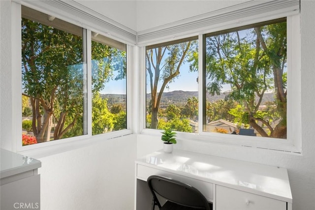 sunroom / solarium with a mountain view