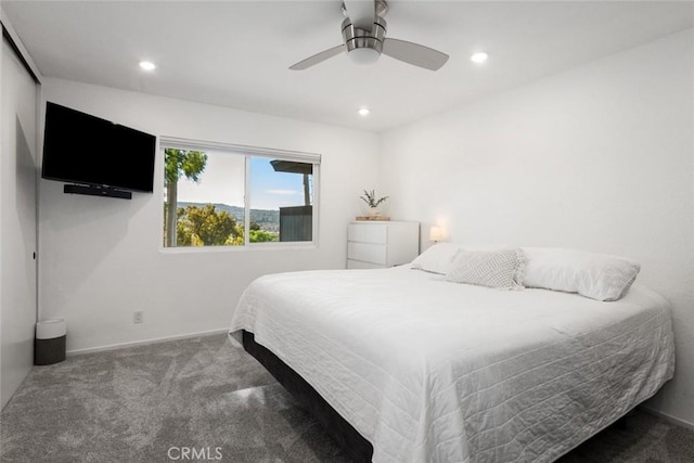 bedroom with ceiling fan and carpet floors