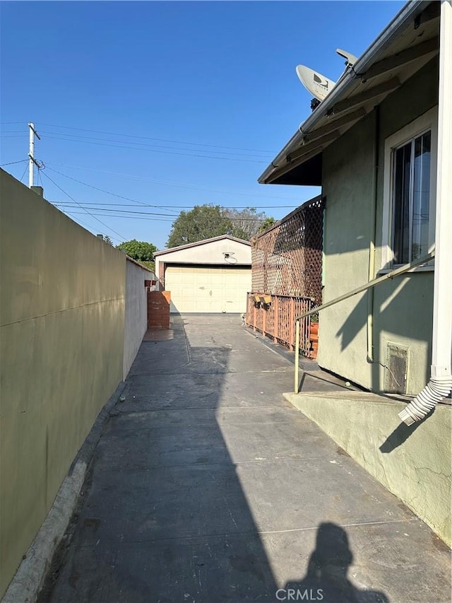 view of home's exterior featuring a garage and an outdoor structure