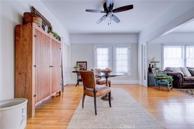 dining space featuring ceiling fan and light hardwood / wood-style floors