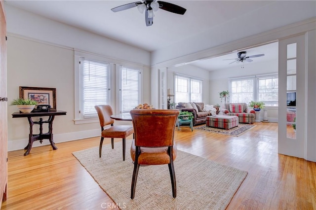 dining space featuring ceiling fan and light hardwood / wood-style floors