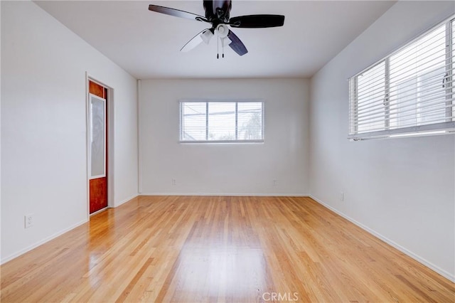 spare room featuring ceiling fan and light wood-type flooring