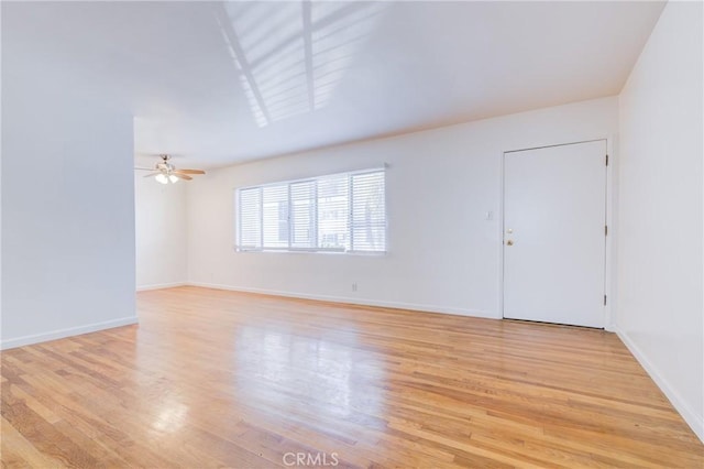 unfurnished room with ceiling fan and light hardwood / wood-style flooring