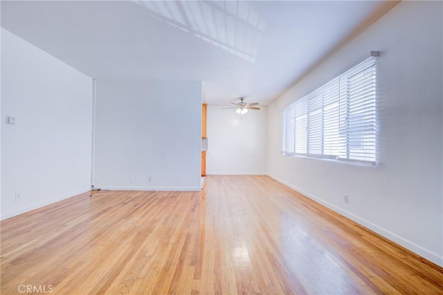 unfurnished room featuring ceiling fan and light hardwood / wood-style floors