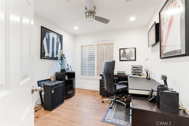 home office featuring ceiling fan and light hardwood / wood-style floors