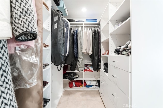 spacious closet featuring light tile patterned flooring