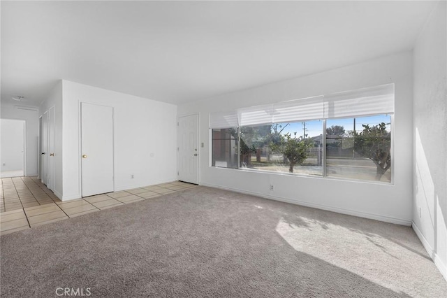 empty room with light colored carpet