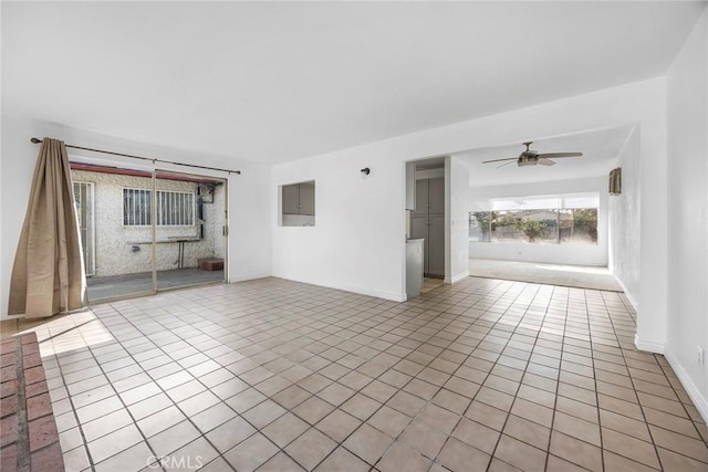 unfurnished room featuring ceiling fan and light tile patterned flooring