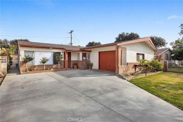 single story home featuring a front yard and a garage