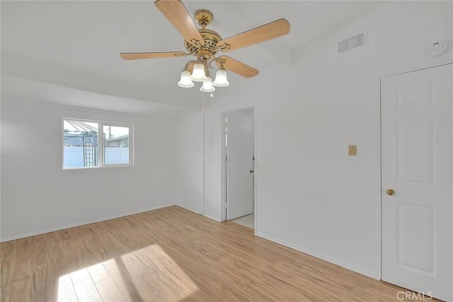 empty room featuring light hardwood / wood-style flooring and ceiling fan