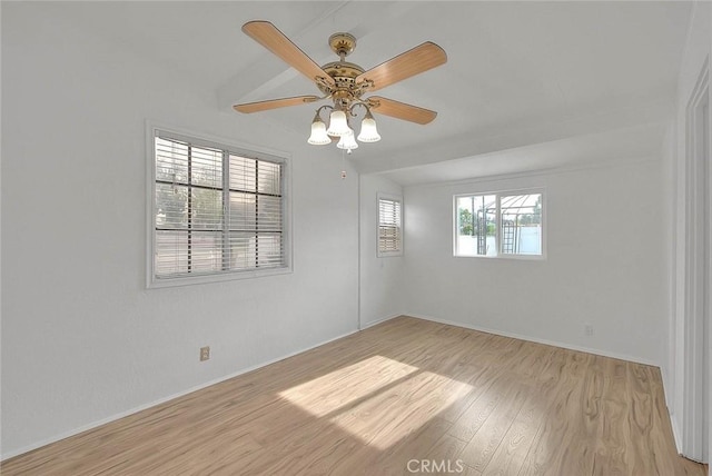 empty room featuring ceiling fan and light hardwood / wood-style flooring