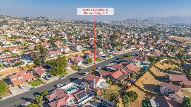 birds eye view of property with a mountain view