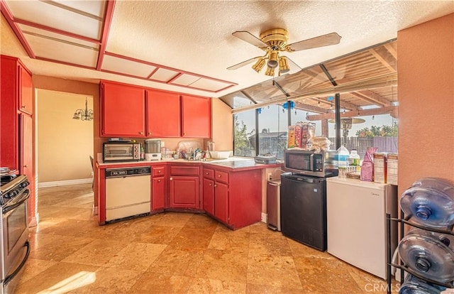 kitchen featuring a wealth of natural light, ceiling fan, a textured ceiling, and appliances with stainless steel finishes